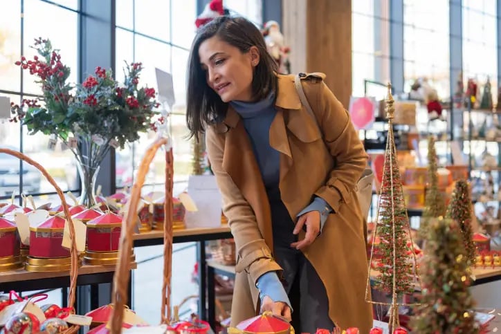 Woman browsing holiday products at a store