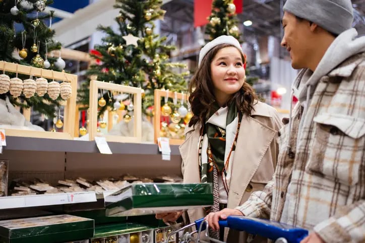 Young couple shopping for Christmas decorations