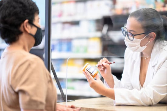 pharmacist helping a client