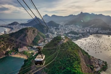 View from a cable car over Rio de Janiero from sugar loaf mountain at golden hour
