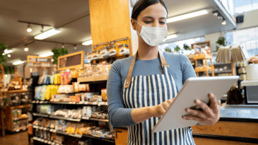 Woman working at supermarket doing stock inventory