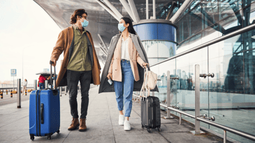 Couple with suitcases at the airport