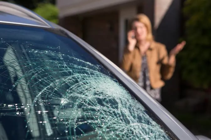 Woman calling to repair broken windshield