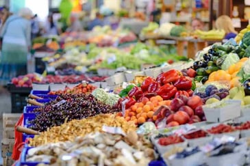 Produce stands in a farmers market