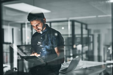 man at work holding a tablet