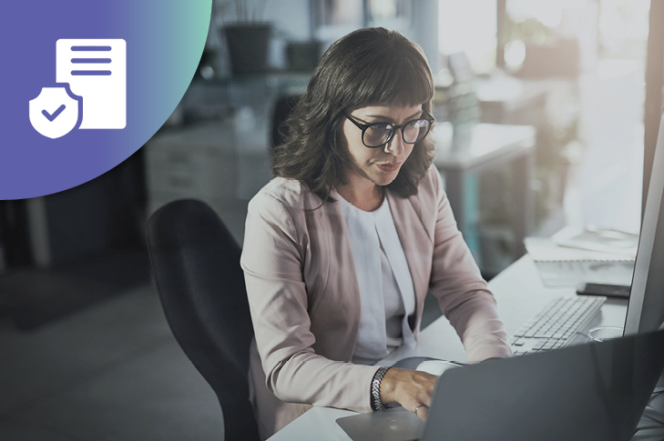 woman at work looking at her laptop