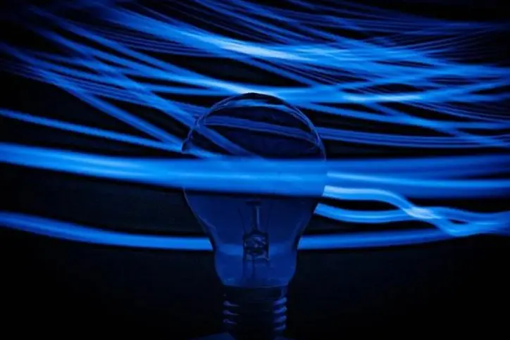 blue lights surrounding a lightbulb
