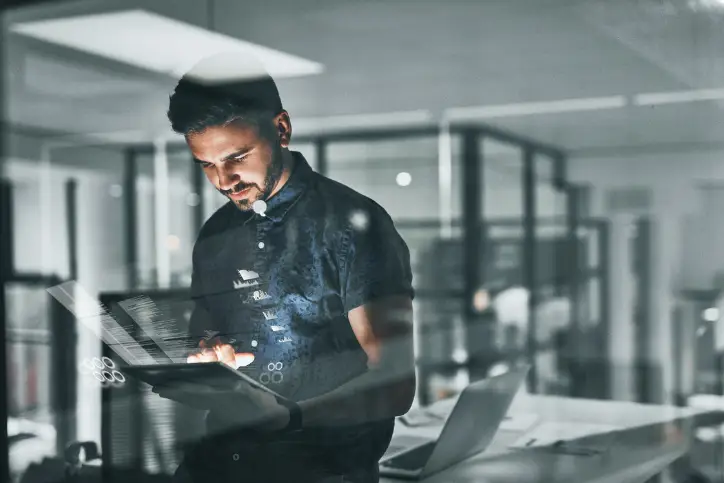 man at work holding a tablet