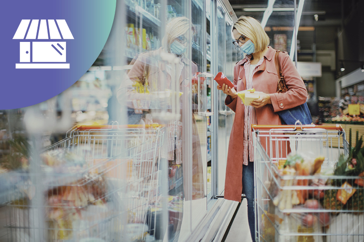 woman at the grocery store adding items to her shopping cart