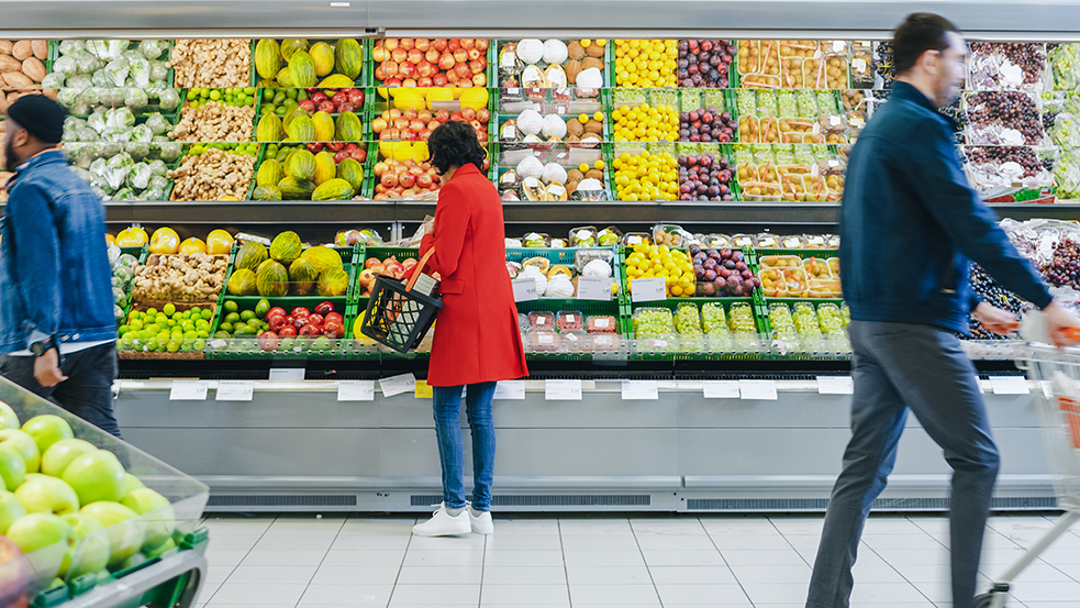 people shopping for fresh food in grocery store